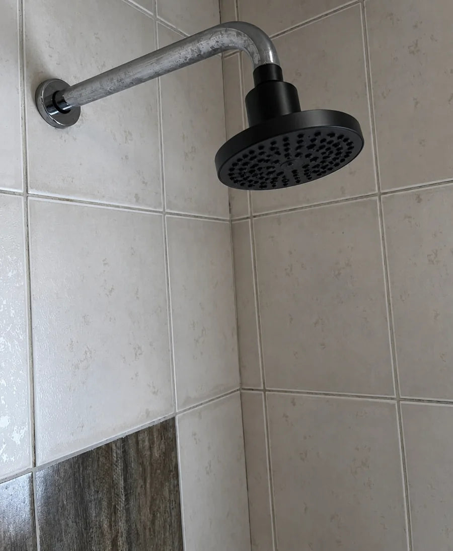 Customer photo of a VALOIR shower head installed in a tiled shower